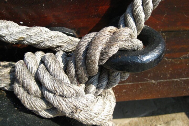 Manila rope knotted around an iron ring