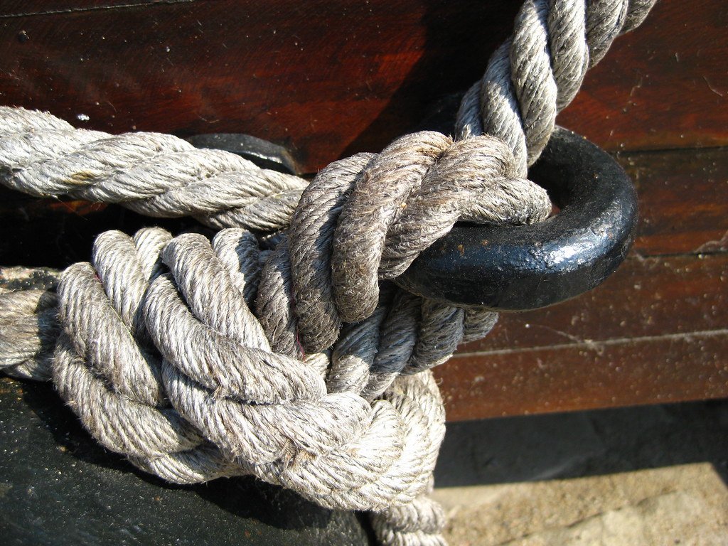 Manila rope knotted around an iron ring
