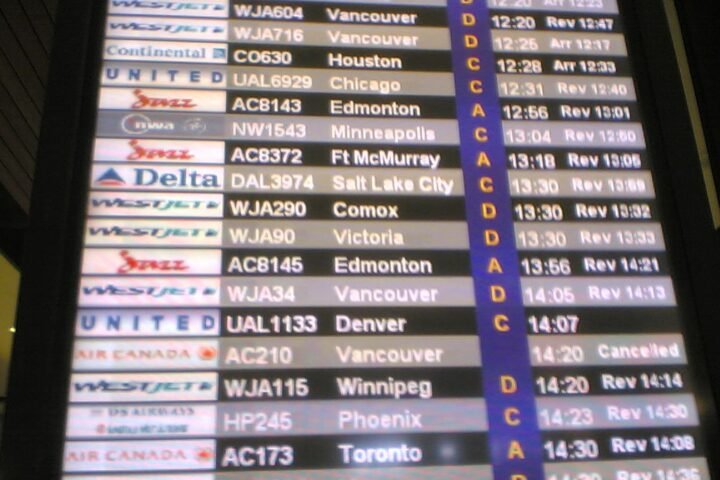 Flight arrivals board at Calgary International Airport