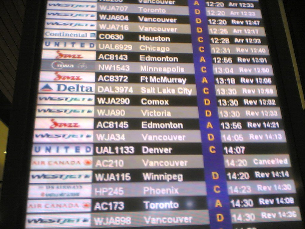 Flight arrivals board at Calgary International Airport