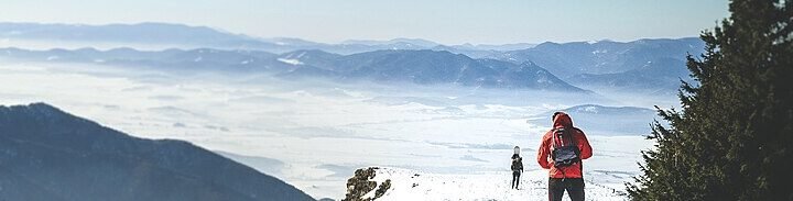 Hikers walking in winter in the Turiec region