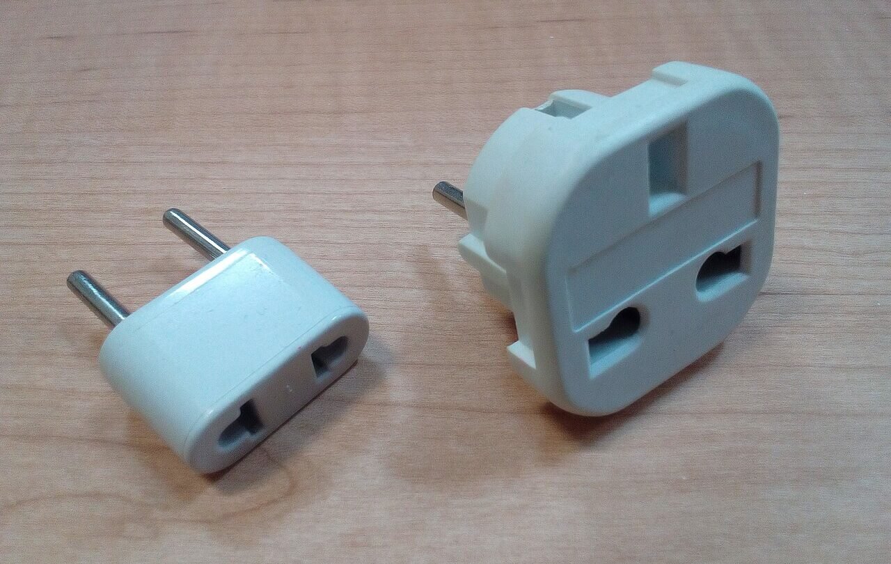 Two AC plug adapters for travel