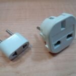 Two AC plug adapters for travel