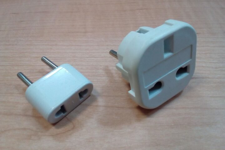 Two AC plug adapters for travel