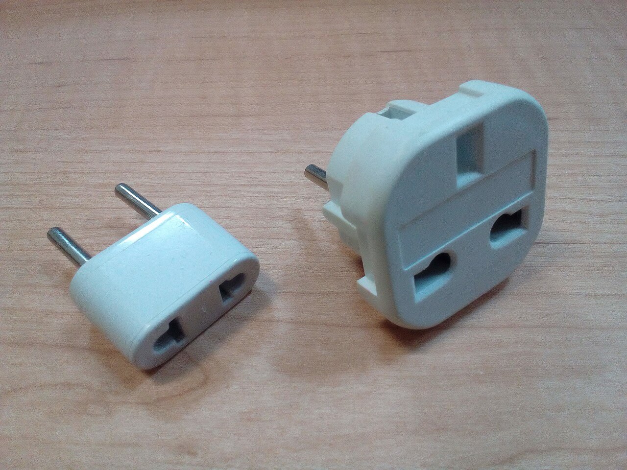 Two AC plug adapters for travel