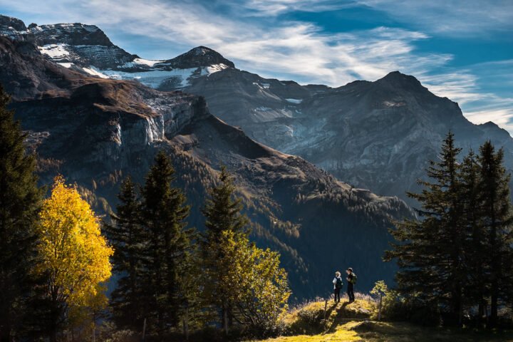 Backpackers looking out over a mountain landscape