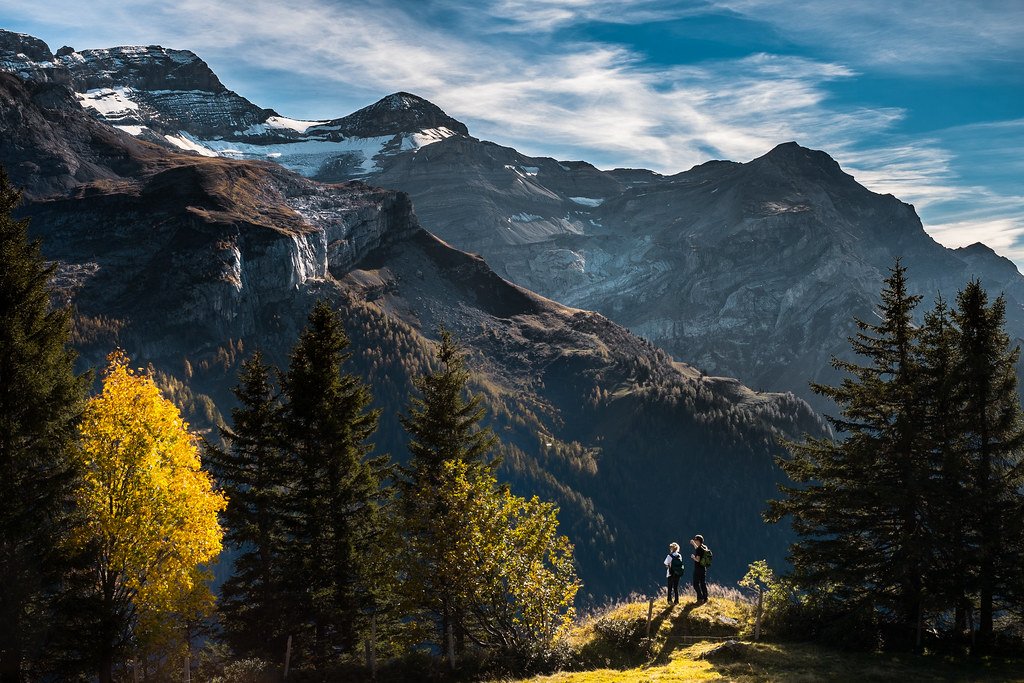 Backpackers looking out over a mountain landscape