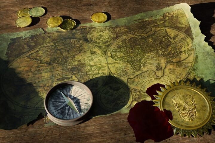 An old world map with a compass