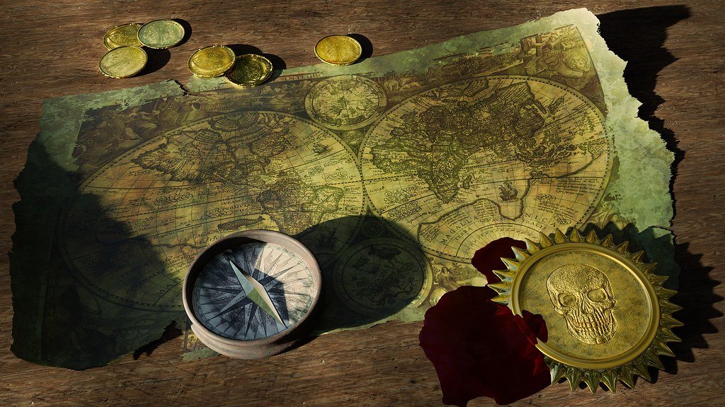 An old world map with a compass