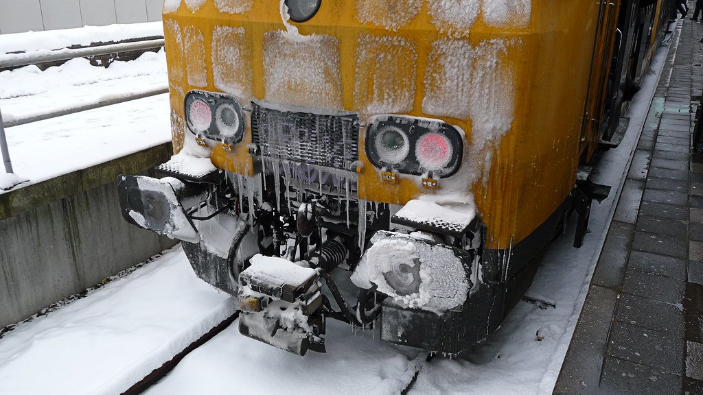 A frozen train in winter at Amsterdam Central Station