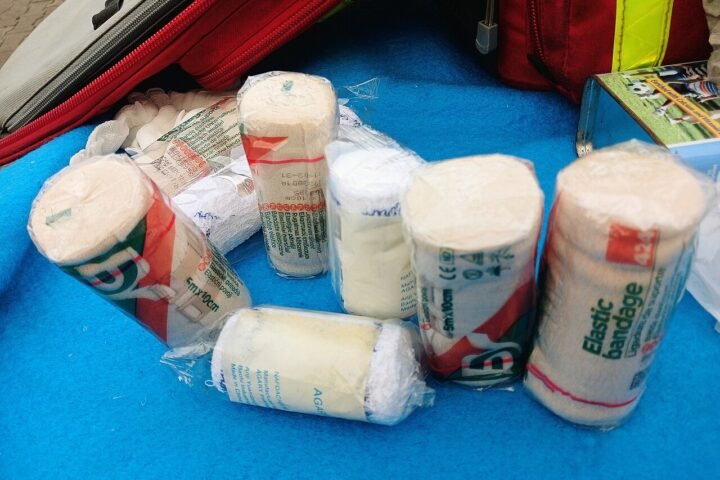 A standard first aid kit with essential emergency medical supplies