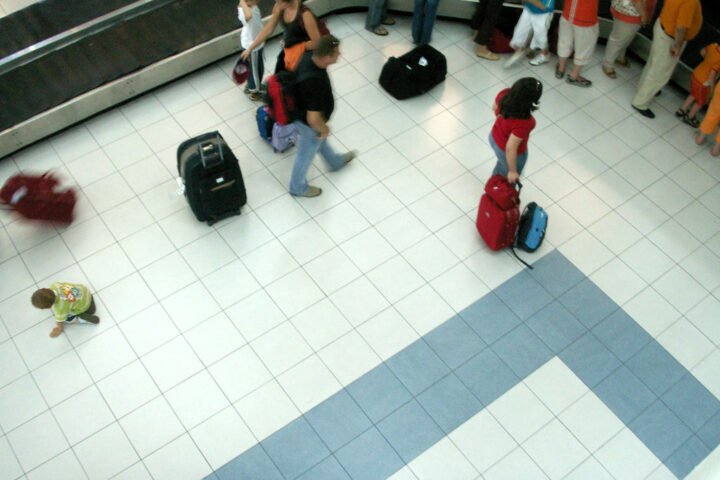 Waiting for luggage to arrive at an airport